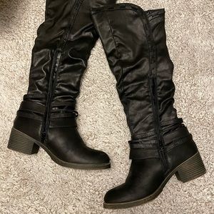 Maurice’s black knee high boots.